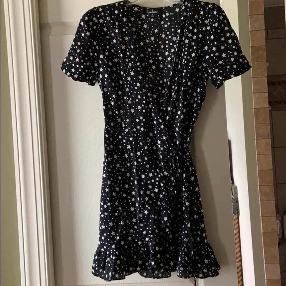 Wrap dress with ruffle side and hem